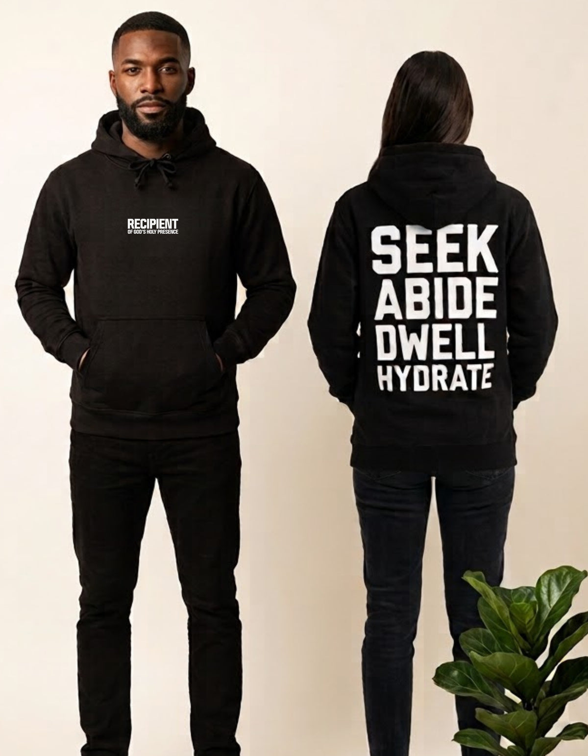 A man and a woman modeling a black hoodie. The man shows the front with a small white 'RECIPIENT OF GOD'S HOLY PRESENCE' logo on the chest, and the woman shows the back with large white text reading 'SEEK ABIDE DWELL HYDRATE'.
