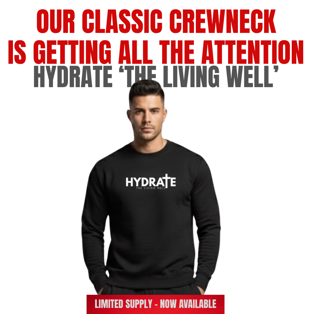 Person wearing a black 'HYDRATE' sweatshirt with promotional text on a white background. Perfect for the fall season and the holidays.