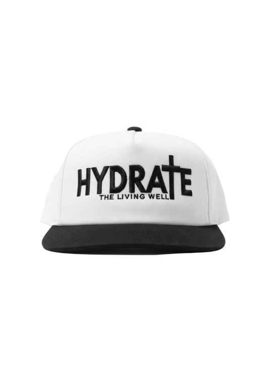 White cap with black text 'HYDRATE THE LIVING WELL' on a white background