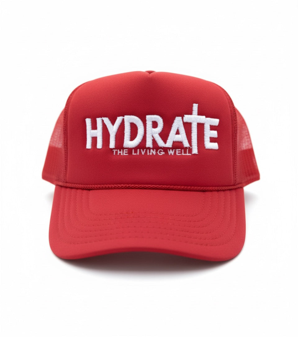 Red cap with 'HYDRATE THE LIVING WELL' text on a white background